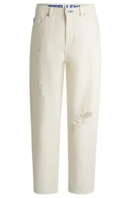 Vaqueros relaxed fit de denim desgastado y pernera ancha