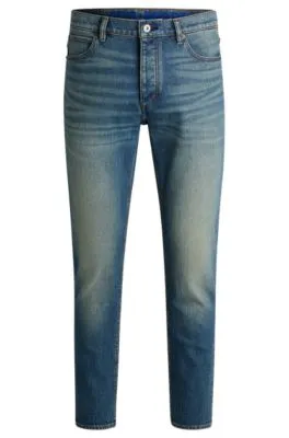 Vaqueros tapered fit de denim teñido azul