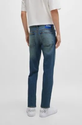 Vaqueros tapered fit de denim teñido azul