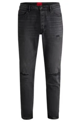 Vaqueros tapered fit en denim desgastado negro