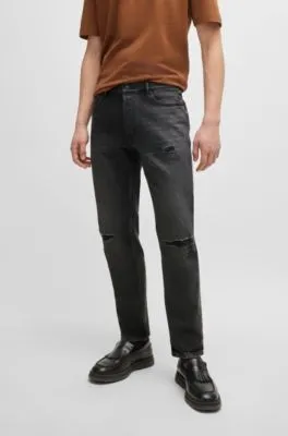 Vaqueros tapered fit en denim desgastado negro