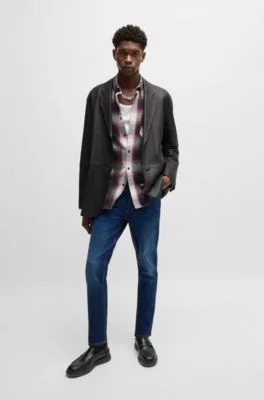 Vaqueros tapered fit en denim elástico azul muy cómodo